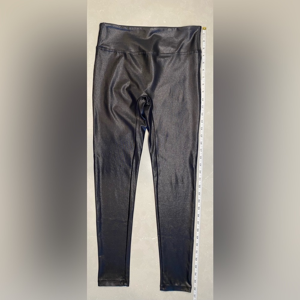 Black shimmer faux leather high-wasted leggings. Super soft and form flattering!